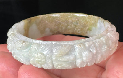 Solid icy forest green and honey orange natural Type A Burmese jade bangle bracelet with carved floral design, size 58.7mm