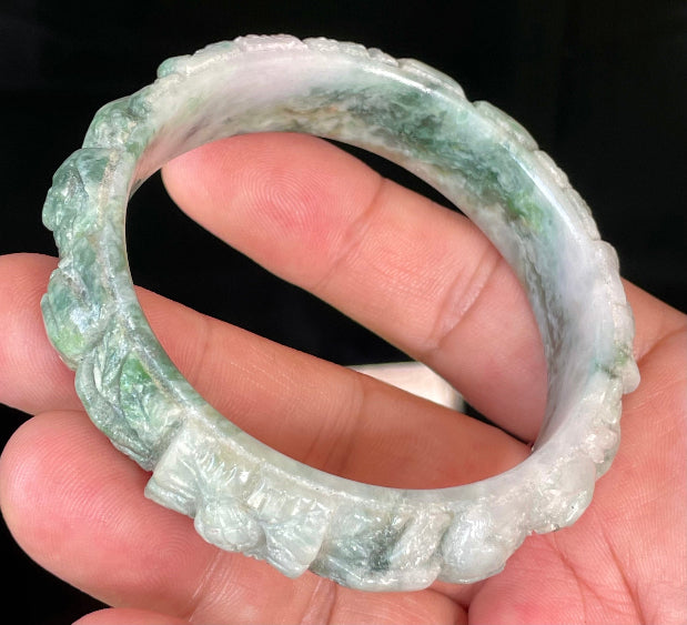 Solid icy emerald and imperial green natural Type A Burmese jade bangle bracelet with carved floral design, size 56mm