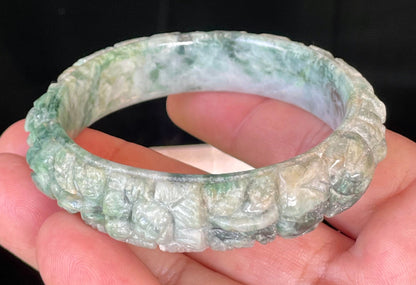 Solid icy emerald and imperial green natural Type A Burmese jade bangle bracelet with carved floral design, size 56mm