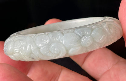 Solid icy translucent apple green natural Type A Burmese jade bangle bracelet with carved floral design, size 50.7mm