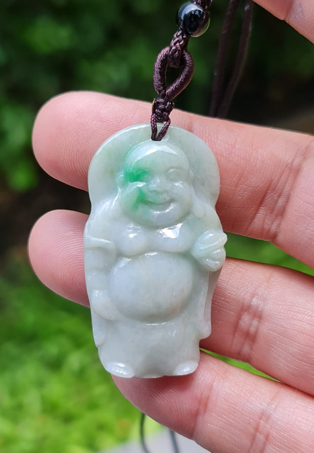 Untreated Type A Burmese jade pendant showing semi-translucent luster with beautiful icy green and soft lavender tones on an adjustable cord