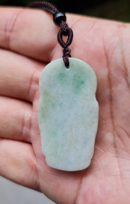 Untreated Type A Burmese jade pendant showing semi-translucent luster with beautiful icy green and soft lavender tones on an adjustable cord