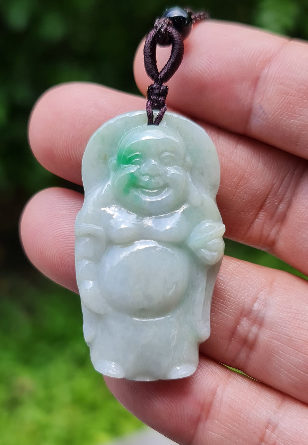 Untreated Type A Burmese jade pendant showing semi-translucent luster with beautiful icy green and soft lavender tones on an adjustable cord