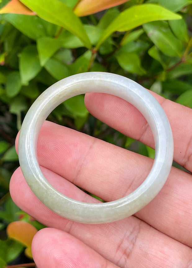 Solid icy white, greyish, and moss green natural Type A Burmese baby jade bangle bracelet in size 40.5mm