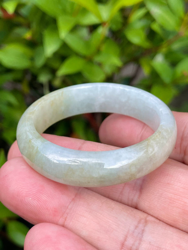 Solid icy white, greyish, and moss green natural Type A Burmese baby jade bangle bracelet in size 40.5mm