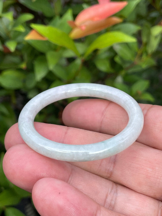 Solid icy white and imperial green natural Type A Burmese baby jade bangle bracelet in size 42.5mm