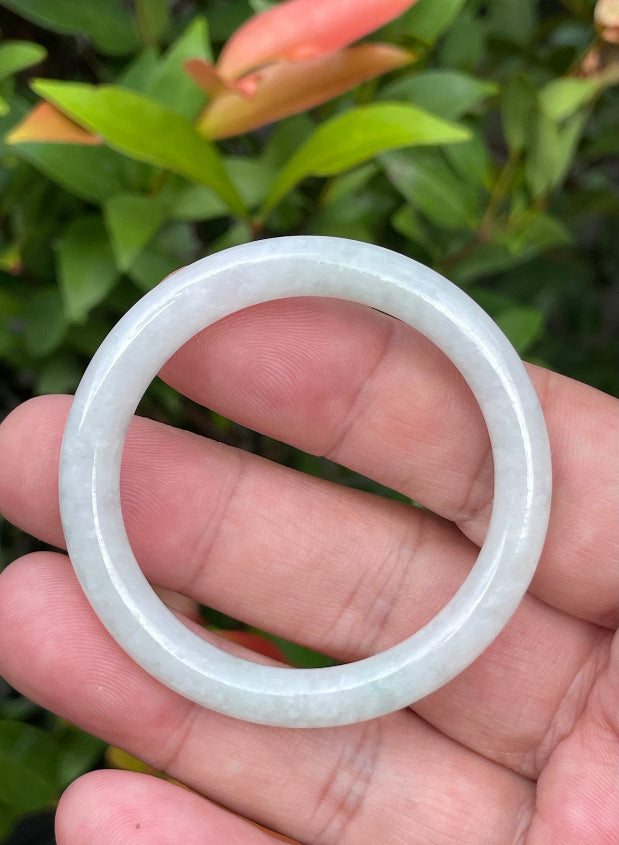 Solid icy white and imperial green natural Type A Burmese baby jade bangle bracelet in size 42.5mm