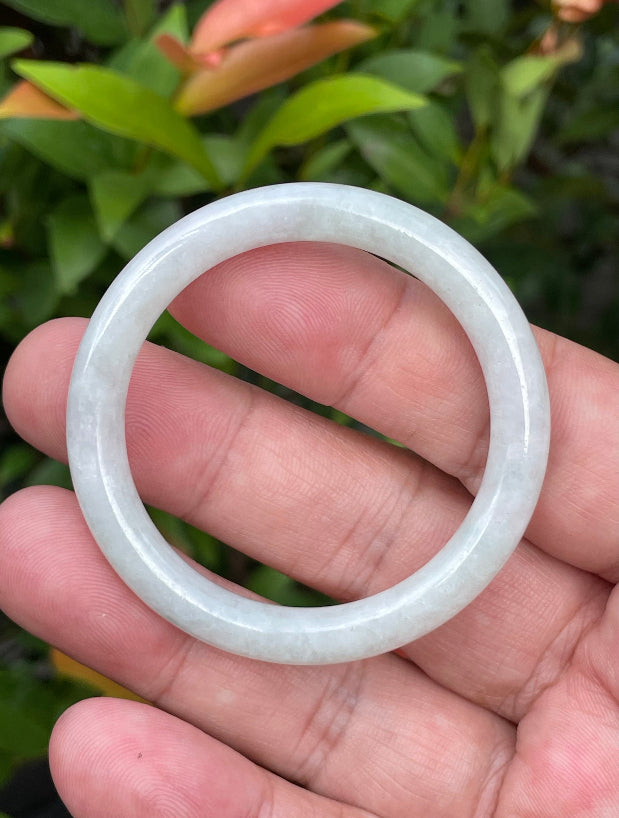 Solid icy white and imperial green natural Type A Burmese baby jade bangle bracelet in size 42.5mm