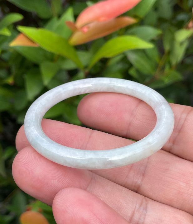 Solid icy white and apple green natural Type A Burmese baby jade bangle bracelet in size 43mm