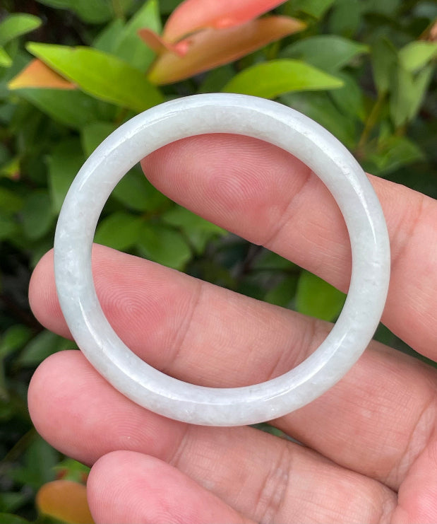 Solid icy white and apple green natural Type A Burmese baby jade bangle bracelet in size 43mm
