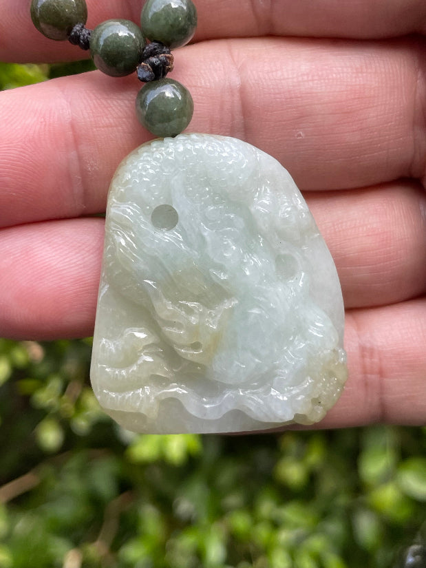 [JP067] Close-up of semi-translucent untreated Type A green jade dragon carving