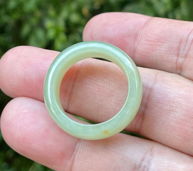 Solid icy apple green and honey natural Type A Burmese jade ring band in size US 12
