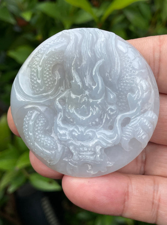 Close-up of a natural certified Grade A Burmese jadeite pendant in icy lavender, moss green, and milky white carved as a Dragon, item JP051