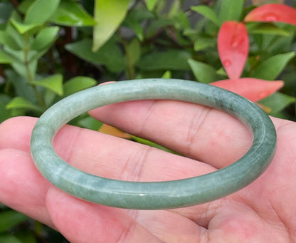 Handcrafted genuine Grade A Burmese jadeite slim stackable bracelet showcasing a translucent elegant appearance