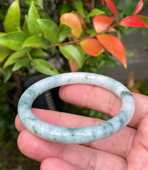 Handcrafted genuine Grade A Burmese jadeite bracelet showcasing a beautiful blue, green, and white appearance