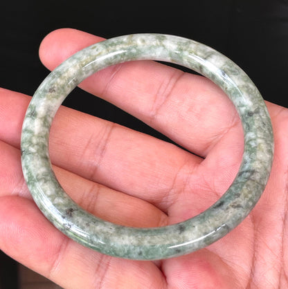 Handcrafted genuine Grade A Burmese jadeite bracelet showcasing a beautiful vibrant green and white appearance