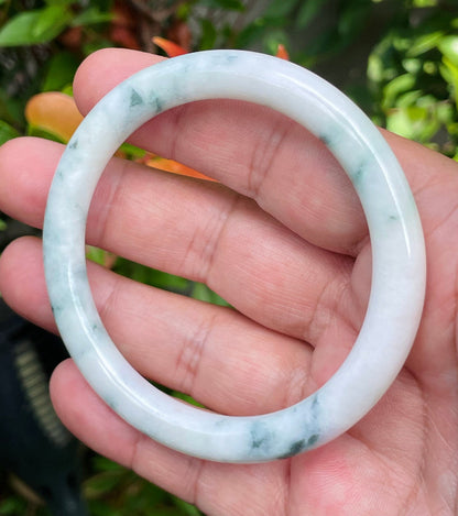 Handcrafted genuine Grade A Burmese jadeite bracelet showcasing a beautiful serene white and green appearance