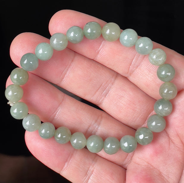 Handcrafted genuine Grade A Burmese jadeite stretch bracelet showcasing beautiful apple green beads