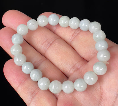 Handcrafted genuine Grade A Burmese jadeite stretch bracelet showcasing beautiful icy apple green and milky white round beads