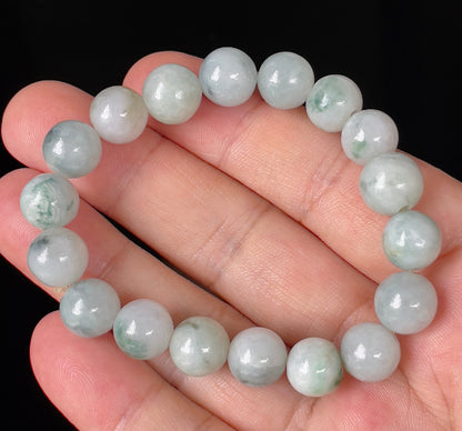 Handcrafted genuine Grade A Burmese jadeite stretch bracelet showcasing beautiful icy apple green, imperial green, and grayish milky white round beads