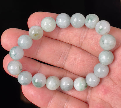 Handcrafted genuine Grade A Burmese jadeite stretch bracelet showcasing beautiful icy apple green, imperial green, and grayish milky white round beads