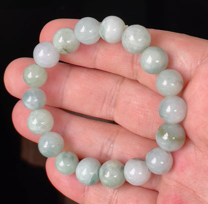Handcrafted genuine Grade A Burmese jadeite stretch bracelet showcasing beautiful imperial green and white round beads