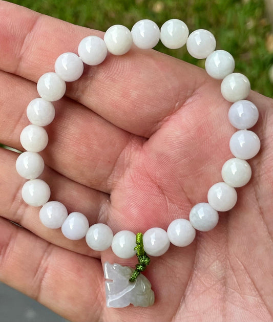 Close-up of a 7.8mm natural Grade A Burmese jadeite beaded bracelet featuring milky white and light lavender beads with a tiger pendant, item JBB177
