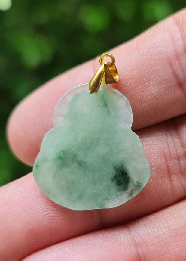 Handcrafted genuine Grade A Burmese jadeite amulet with icy green tones and a natural golden bail