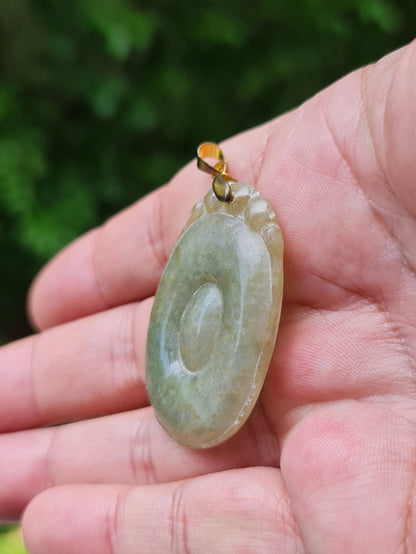 Handcrafted genuine Grade A Burmese jadeite amulet representing eternity and spiritual protection