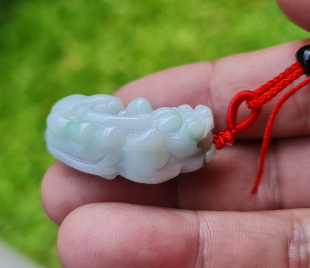 Handcrafted genuine Grade A Burmese jadeite amulet with icy bluish and imperial green colors representing mental clarity and prosperity