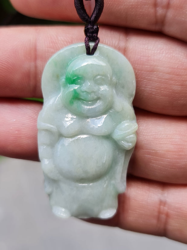 Close-up of a natural Grade A Burmese jadeite pendant featuring icy translucency and imperial green hues hand-carved with a Happy Buddha motif, item JP026