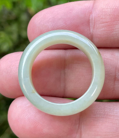 Hand-carved genuine Grade A Burmese jadeite round ring blending icy apple green and delicate honey tones