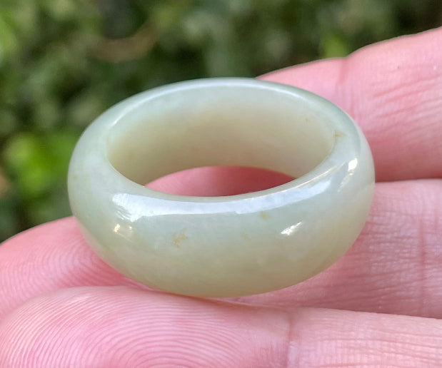 Hand-carved genuine Grade A Burmese jadeite round ring blending icy apple green and delicate honey tones