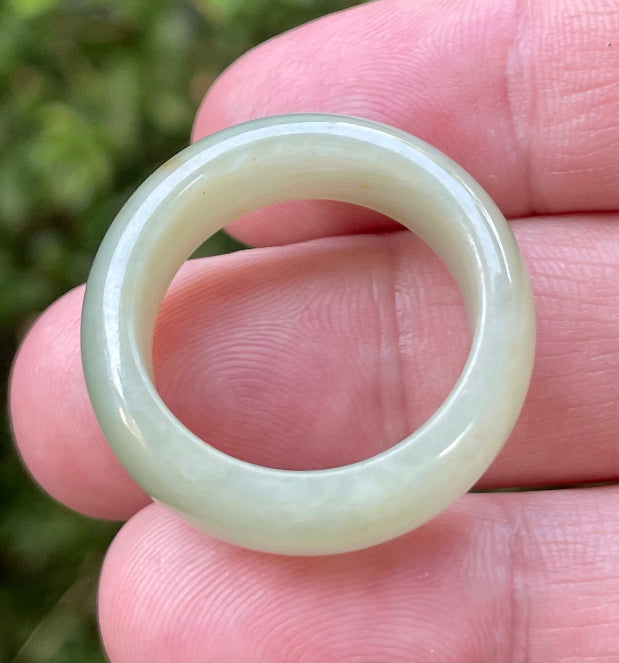 Hand-carved genuine Grade A Burmese jadeite round ring blending icy apple green and delicate honey tones
