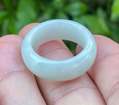 Close-up of a large round natural Grade A Burmese jadeite ring featuring icy apple green and milky white, item JRN042