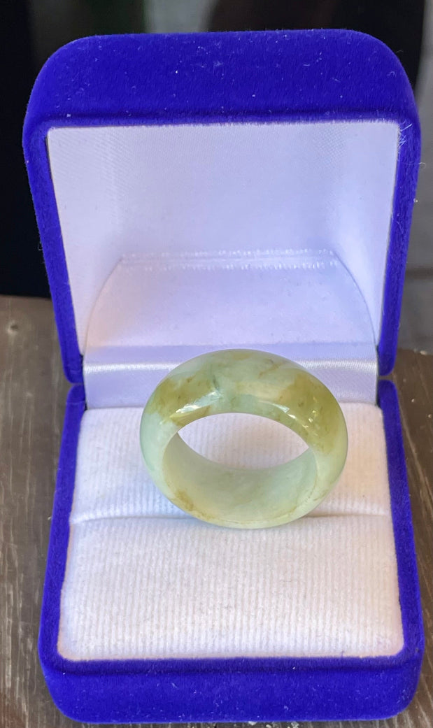 Hand-carved genuine Grade A Burmese jadeite ring showcasing a raised central groove and icy imperial green color