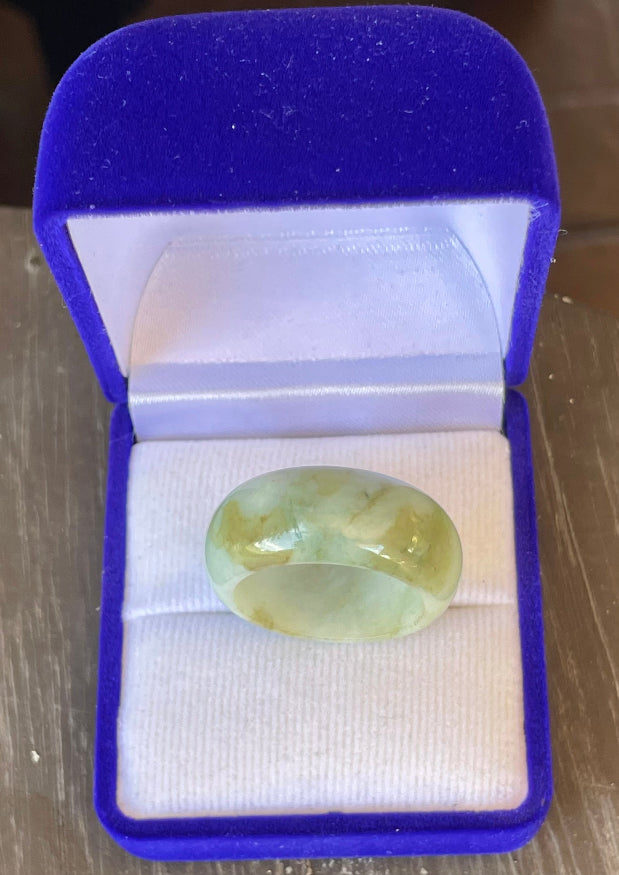 Hand-carved genuine Grade A Burmese jadeite ring showcasing a raised central groove and icy imperial green color