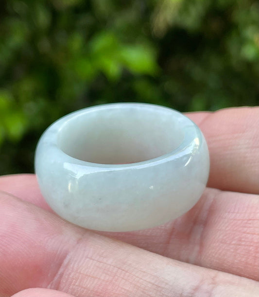 Close-up of a large rounded natural Grade A Burmese jadeite ring featuring icy greyish milky white hues, item JRN041