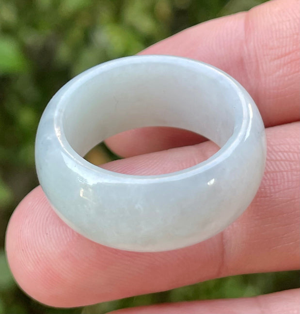 Hand-carved genuine Grade A Burmese jadeite rounded ring showcasing a serene icy milky white translucency