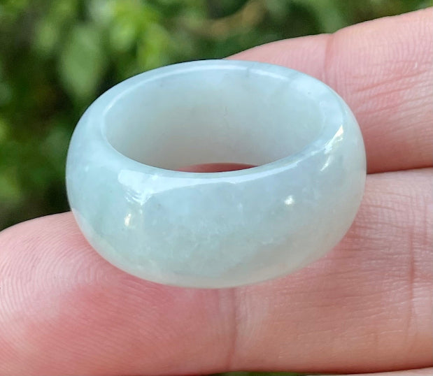 Hand-carved genuine Grade A Burmese jadeite rounded ring showcasing a serene icy milky white translucency