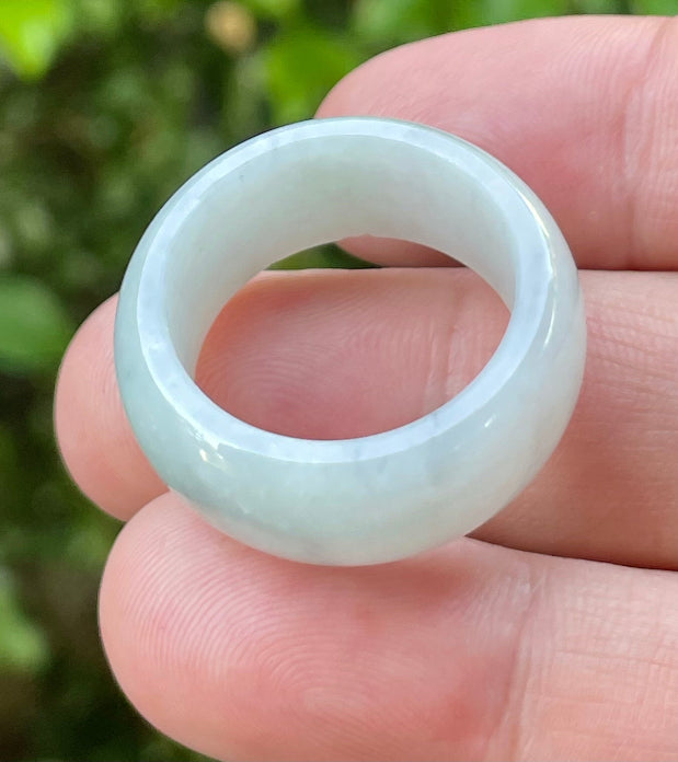 Hand-carved genuine Grade A Burmese jadeite rounded ring showcasing a serene icy milky white translucency