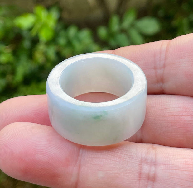 Hand-carved genuine Grade A Burmese jadeite wide band showcasing a serene icy milky white base and imperial green swirls