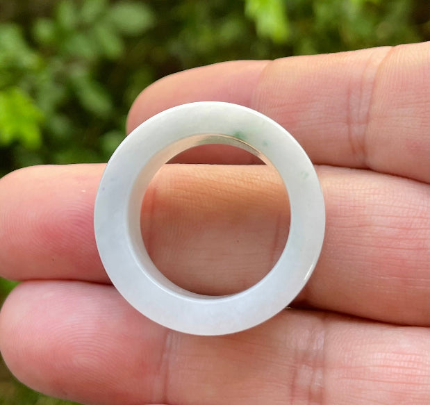 Hand-carved genuine Grade A Burmese jadeite wide band showcasing a serene icy milky white base and imperial green swirls