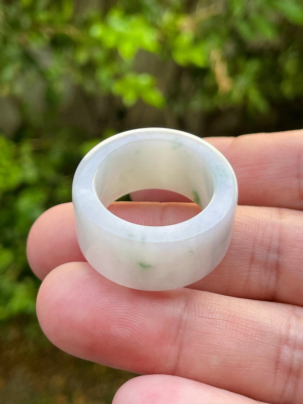 Hand-carved genuine Grade A Burmese jadeite wide band showcasing a serene icy milky white base and imperial green swirls