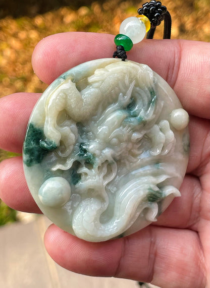Handcrafted genuine Grade A certified Burmese jadeite amulet with green and milky white colors representing prosperity and purification