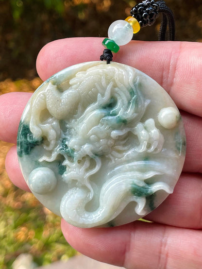 Handcrafted genuine Grade A certified Burmese jadeite amulet with green and milky white colors representing prosperity and purification