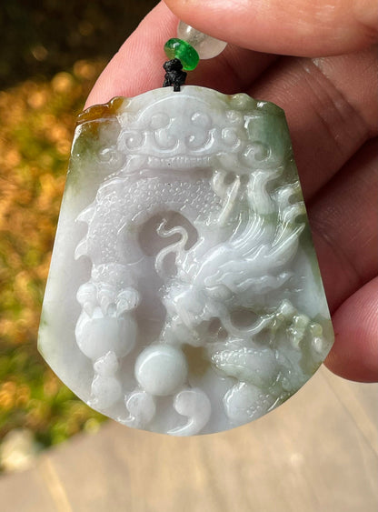Handcrafted genuine Grade A certified Burmese jadeite amulet with green and milky white colors representing prosperity and purification