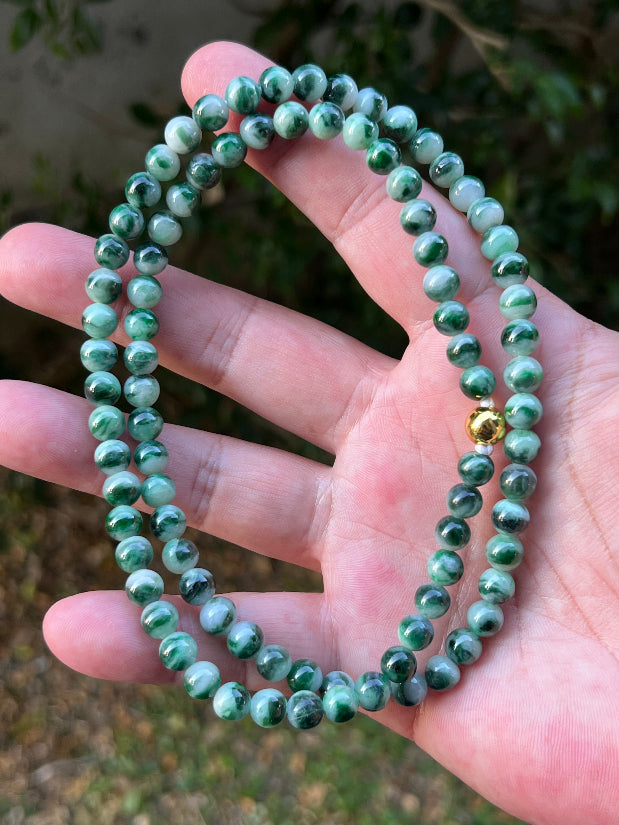 Soft glassy luster and fine crystalline texture of the 6.8mm authentic Myanmar jadeite bead necklace JN087