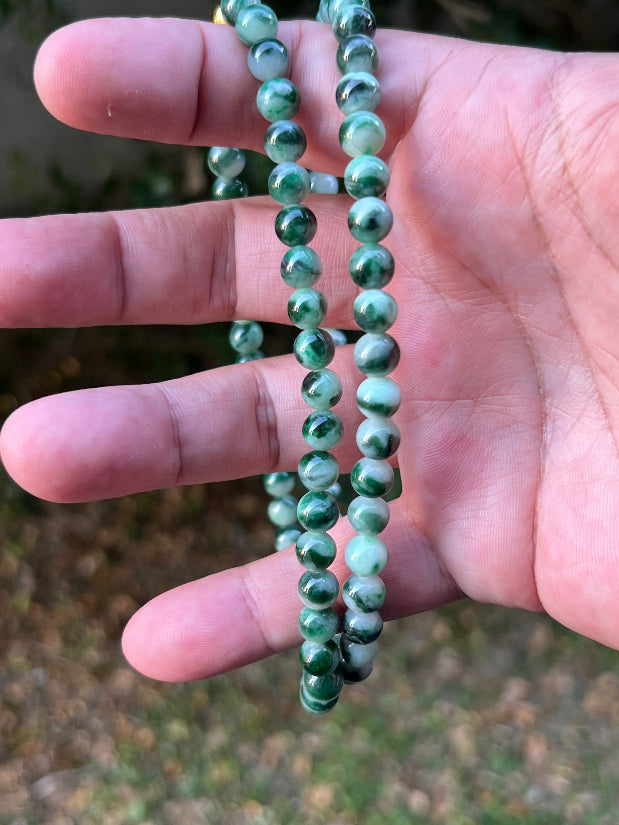 Soft glassy luster and fine crystalline texture of the 6.8mm authentic Myanmar jadeite bead necklace JN087