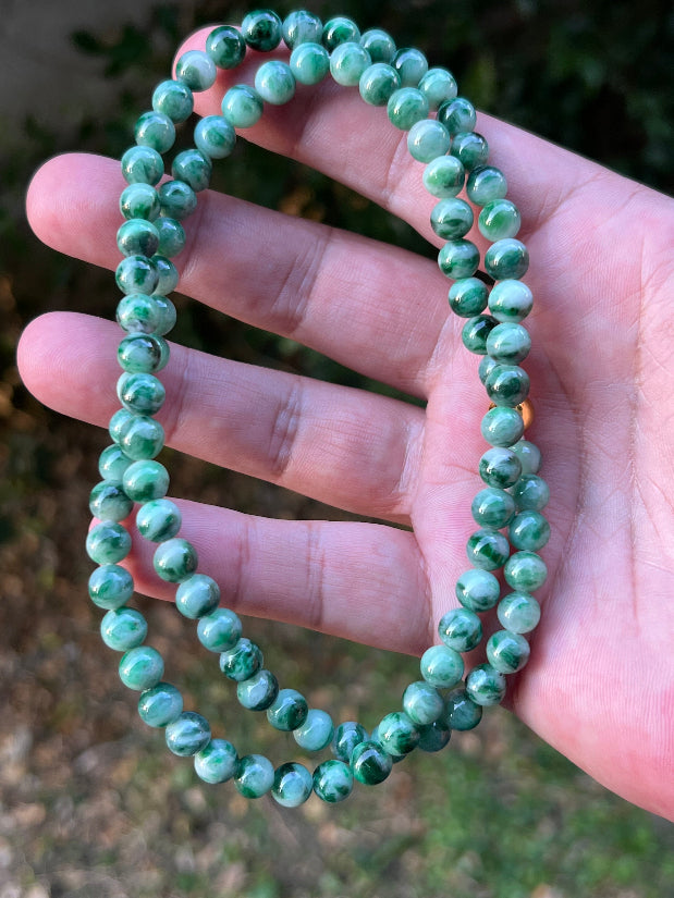Soft glassy luster and fine crystalline texture of the 6.8mm authentic Myanmar jadeite bead necklace JN088